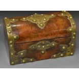 A Victorian walnut and brass mounted domed tea caddy, the cut card brass work with studs,