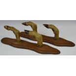Taxidermy - a pair of wall hanging crop racks, each shaped oak mount with two hooves and fetlocks,