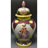 A Vienna baluster vase, printed with the classical graces, within emerald, ruby and yellow border,