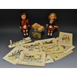 Capstan Navy cut tin; silk cards; two dolls of the World;