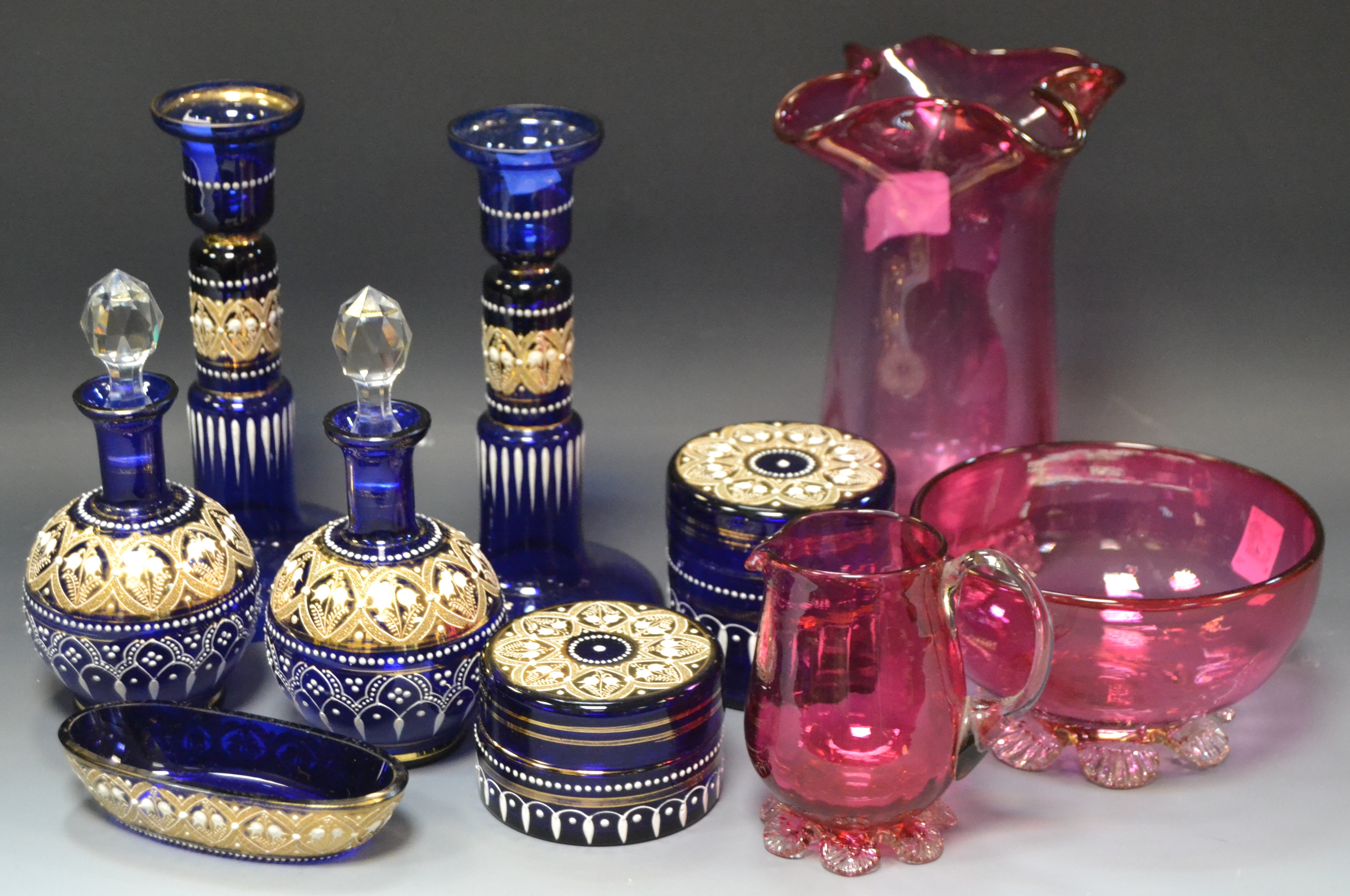 Glassware - a late 19th century Bohemian gilt and white painted blue glass seven piece dressing