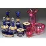 Glassware - a late 19th century Bohemian gilt and white painted blue glass seven piece dressing