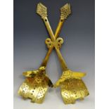 A pair of unusual Dutch 19th century brass skimmers, with Bishop's mitre terminals,
