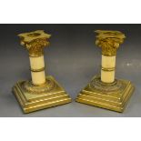 A pair of 19th century gilt metal and ivory Corinthian boudoir candlesticks, detachable sconces,