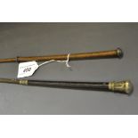 A George V silver mounted lady's riding crop, leather grip, 74cm long, Birmingham 1915; another,