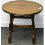 A circular oak occasional table