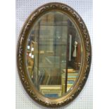 A 20th century oval mirror