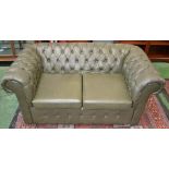 A green leatherette Chesterfield office sofa,