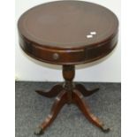 A reproduction mahogany drum table