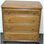 A Priory style chest of four drawers, nulled front to top drawer, acorn handles.