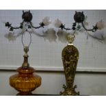 An Amber glass andd gilt metal table lamp; a peacock fan fire screen;