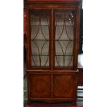 A mahogany inlaid bookcase by Titchmarsh and Goodwin