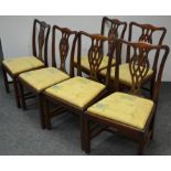 A set of six reproduction mahogany George III style dining chairs,