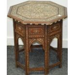 A 19th century ornately inlaid octagonal top table