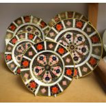 A Royal Crown Derby 1128 pattern plate; a pair of 1128 pattern dessert plates;