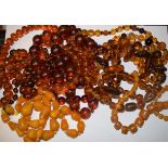 Jewellery - a collection of assorted amber coloured beads, mixed shapes, sizes,