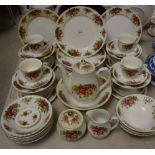 A Royal China English Rose dinner and tea service for eight including dinner plates, side plates,