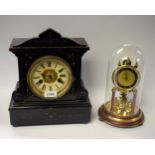 An ebonised wood mantel clock, Roman numerals; an anniversary clock,