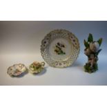 Ceramics - a Meissen pierced plate, floral decoration; a porcelain figure of a cherubic child,