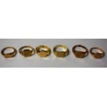 Rings - a gentleman's 9ct gold plain topped signet ring, size P; others sizes R, S,V, W, 22.