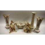 A pair of German porcelain figure groups,