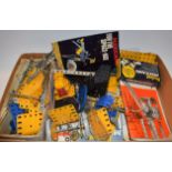 Meccano - assorted parts, inc girders, yellow and blue plates, bolts, curves, wheels, gears,