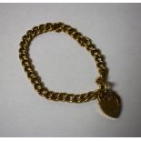 A 9ct gold curb link bracelet, with heart locket (21.