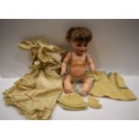 Dolls - a German Schuetzmeister and Quenot porcelain head crying baby doll, blue eyes, open mouth,