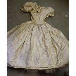 Textiles - a printed cream silk wedding gown, full skirt, net underskirt, fitted button back bodice,