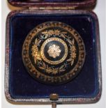 An early Victorian tortoiseshell gold and silver pique brooch