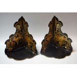 A pair of early 20th century Japanese black lacquer folding wall shelves,