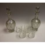 Glassware - a pair of cut glass footed decanters;