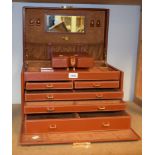 A large tan leather jewellery box, fitted interior to include drawers with necklace pads,