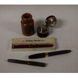 A Sheaffer maroon fountain pen, gold nib; a Conway Stewart ruby lady's pen,