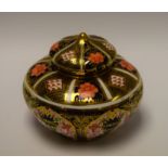 A Royal Crown Derby pumpkin shaped vase and cover