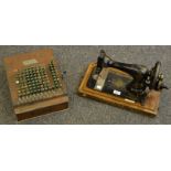 A Singer sewing machine, 10315882; a Felt & Tarrant Mfg.