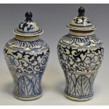 A pair of 18th/19th century Oriental possibly Korean blue and white painted baluster jars and