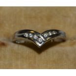 A seven stone diamond wishbone ring,