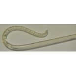 A Victorian glass cane/frigger, spiralled in white, 94cm long, c.