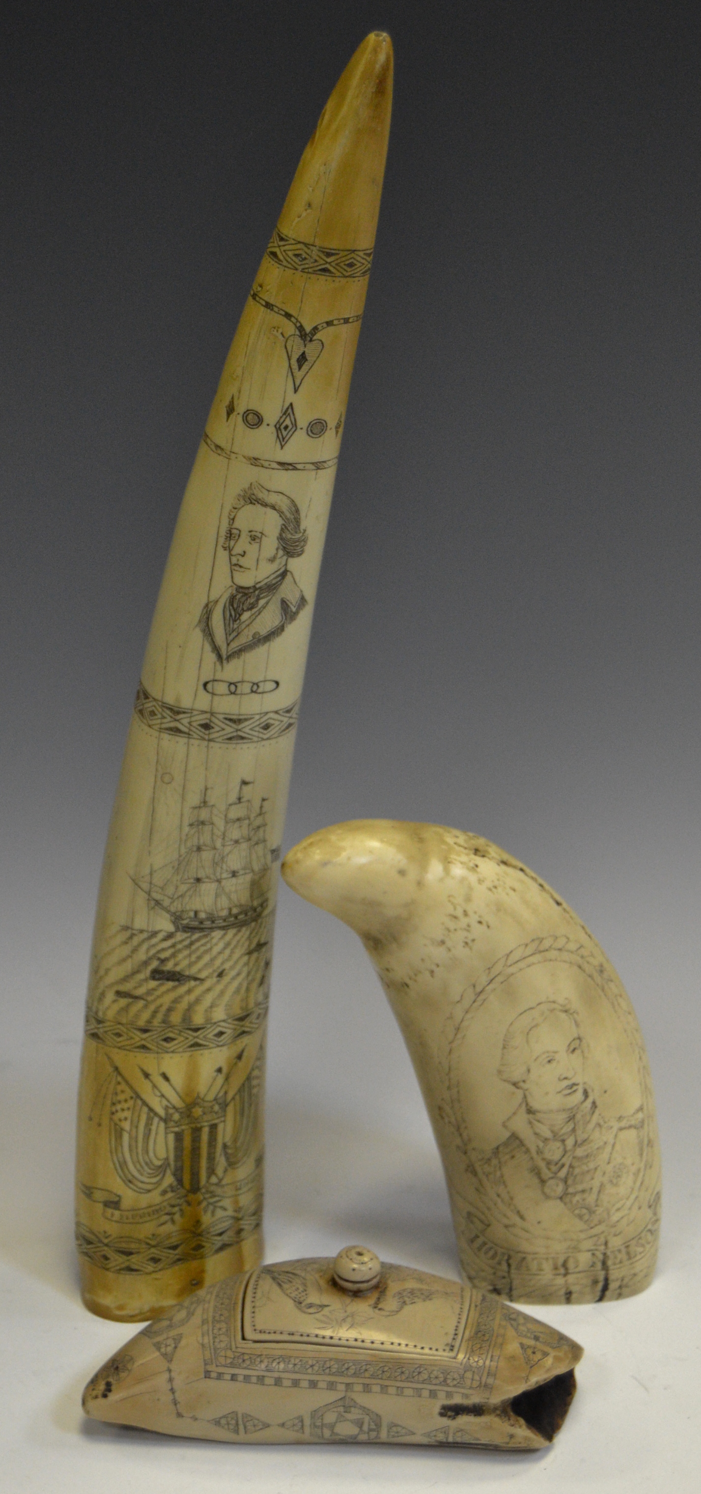A reproduction scrimshaw, carved with The Ship Regulus Captain James Hoad, 35cm long; another,
