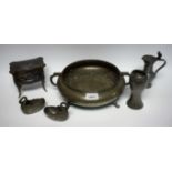 A pewter table casket, as a serpentine fronted commode, hinged cover; a pewter Arts and Crafts vase,