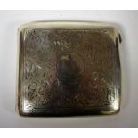 A silver curved rectangular cigarette case, chased and engraved with foliate scrolls,