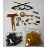 A quantity of banded agate beads; a quantity of graduated amber coloured beads;