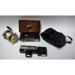 A Garcia Mitchell 600AP fishing reel; a pair of Prinz 8x30 binoculars;