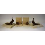 A pair of Art Deco style cold painted book ends, mounted with monkeys; another pair similar,