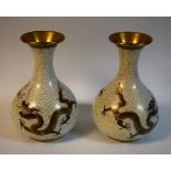 A pair of Chinese cloisonne bottle vases applied with dragons chasing a flaming pearl, 20.