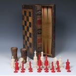 A 19th century bone Barley Corn pattern chess set, red stained opposition,