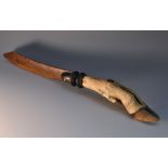 A 19th century taxidermy page turner, fruitwood blade, the haft formed from a deer hoof and fetlock,