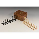 A 19th century bone chess set, possibly Anglo-Indian, black stained opposition, the Kings 8cm high,