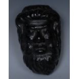 A 19th century cold-painted iron desk weight, as a Bacchic mask,